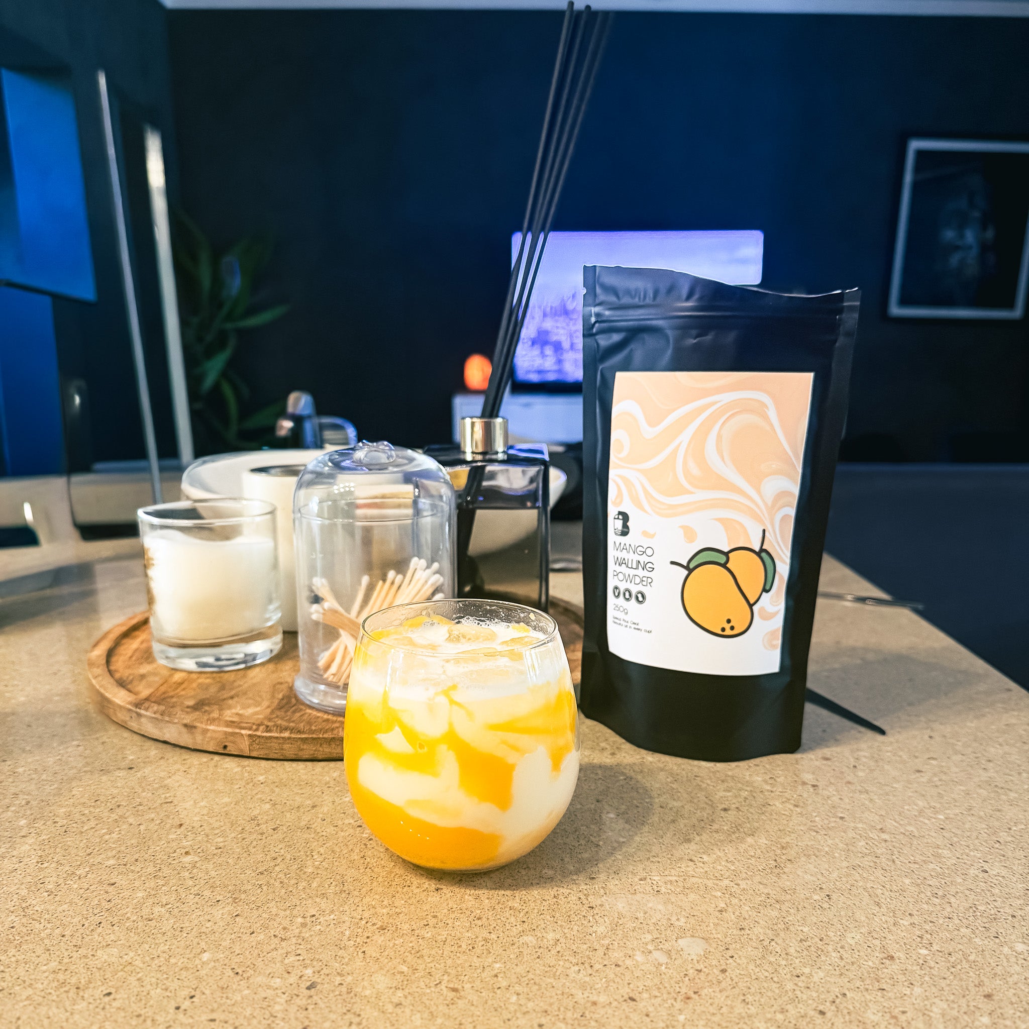 Insta famous walling powder, with a black powder bag, and candles on a table.